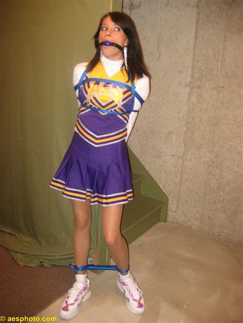 He wrapped her slender ankles in rope and tied them tightly together, before stuffing her mouth with a handkerchief and covering it with duct tape. . Cheerleader tied up and gagged